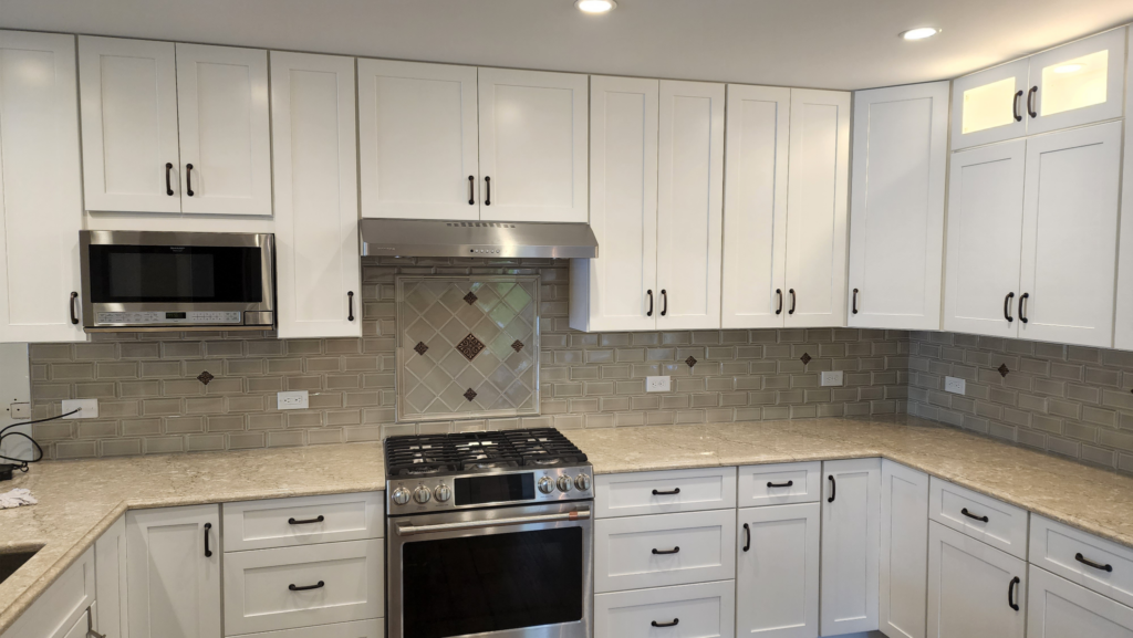 Custom kitchen backsplash installation by Pyle's Tile and Natural Stone in Lake George NY, featuring ceramic and natural stone tiles.